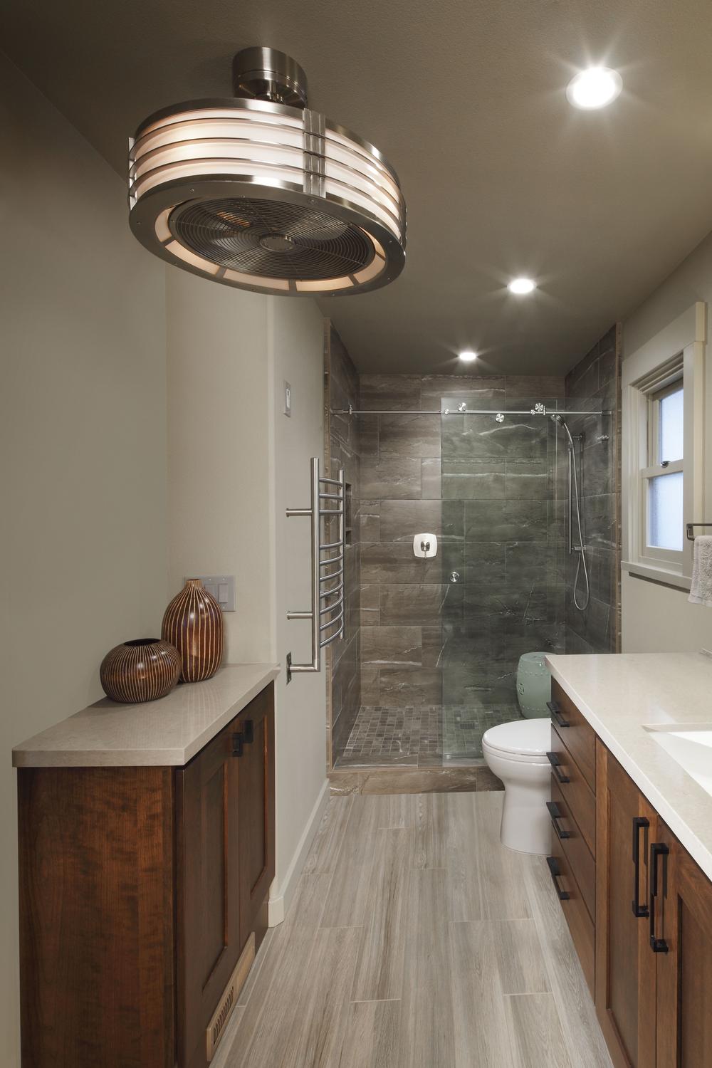 Modern bathroom featuring a combination of dark brown and light accents.
