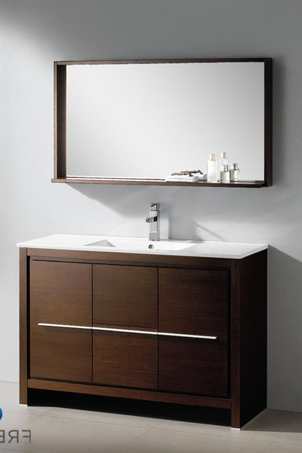 Mueble de baño oscuro y minimalista con encimera blanca
