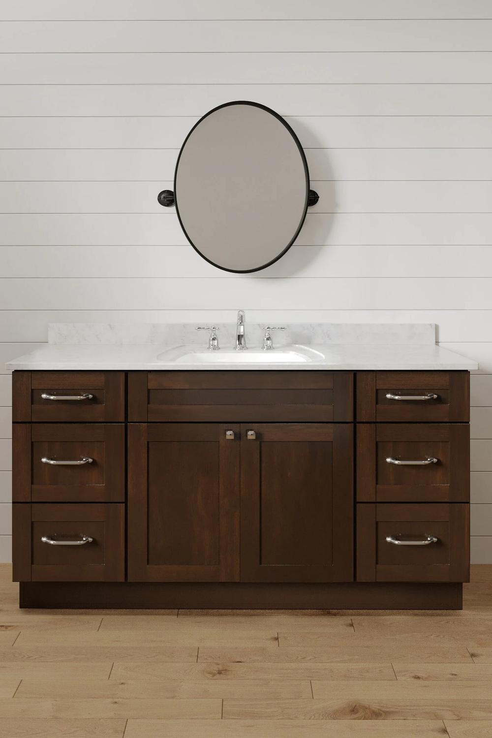 Mueble de baño oscuro con una impresionante encimera