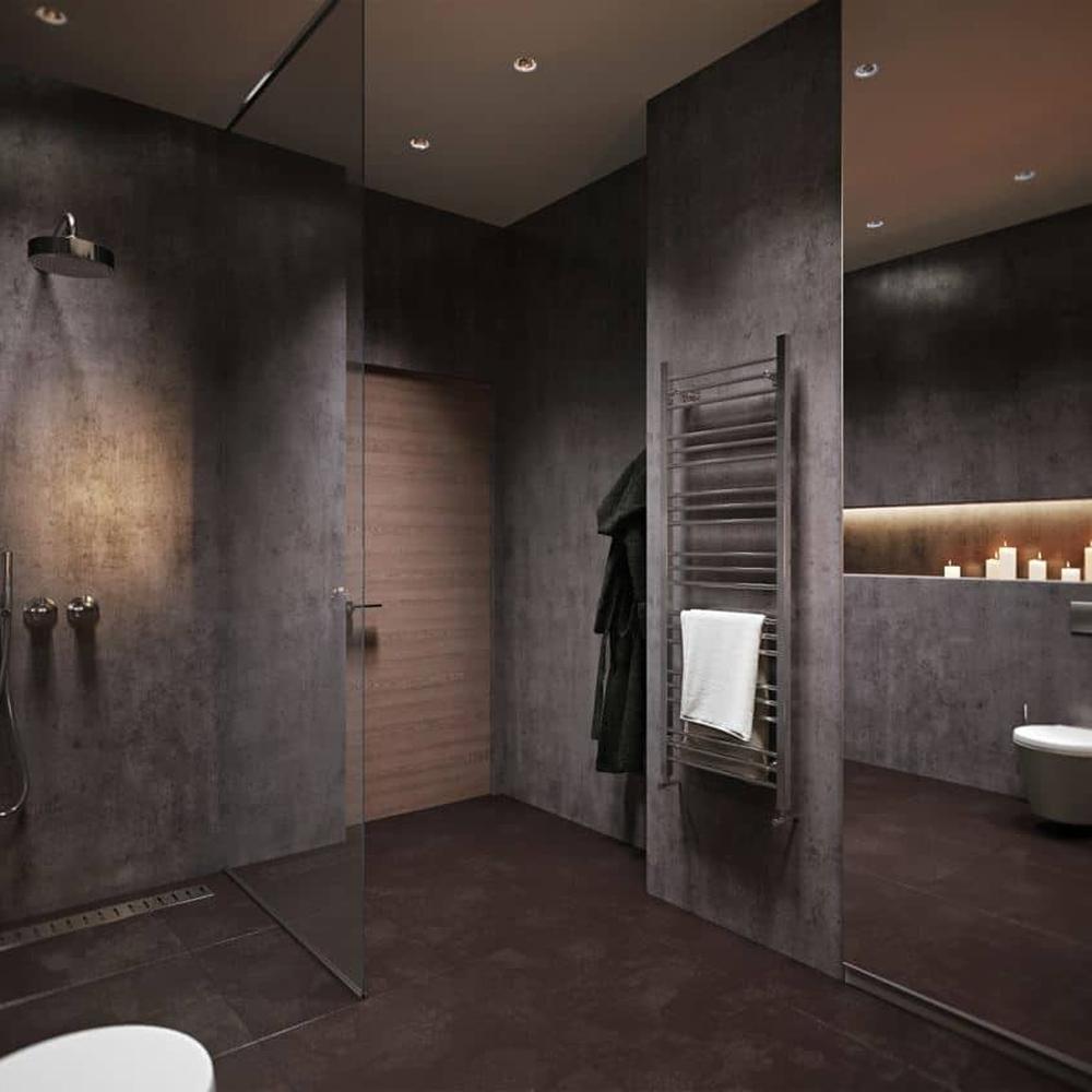 Industrial dark grey bathroom with glass shower area and recessed lights