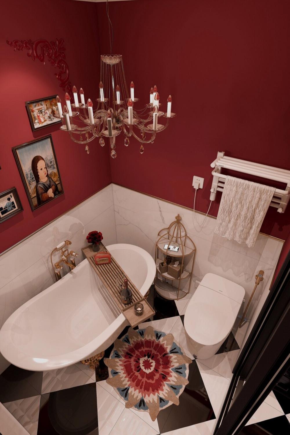 An elegant dark red bathroom with a chandelier and art decor.