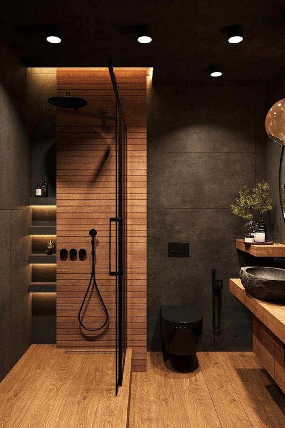 Baño acogedor con tonos oscuros y detalles cálidos