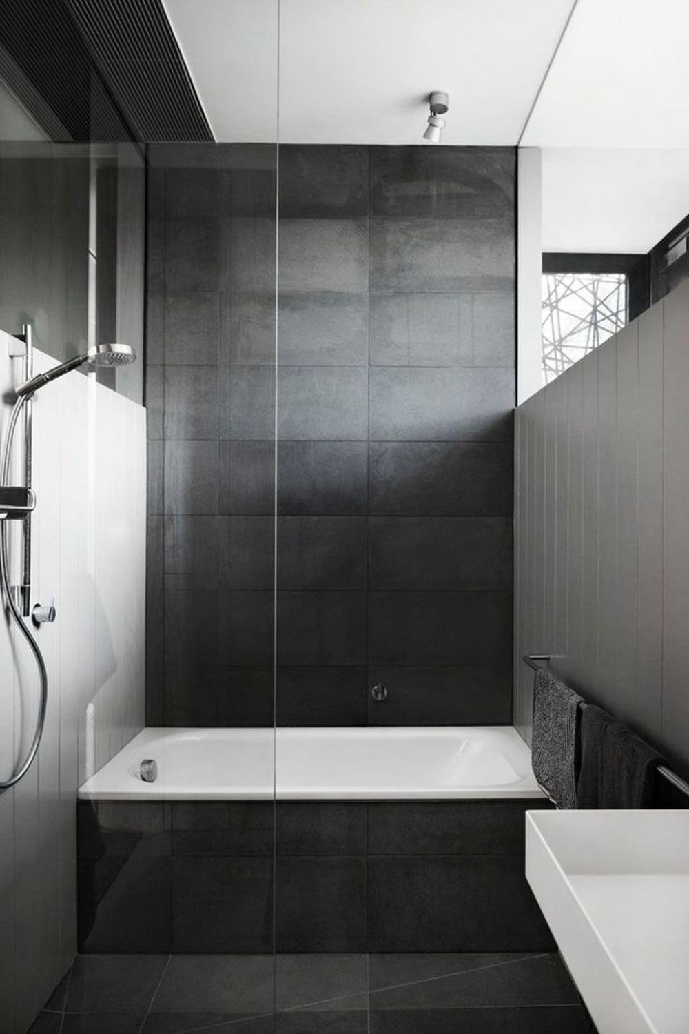 Baño con estilo contemporáneo y elegancia en tonos oscuros