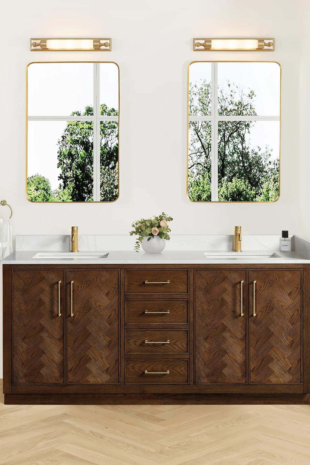 Herringbone patterned dark wood bathroom vanity with stylish gold fixtures
