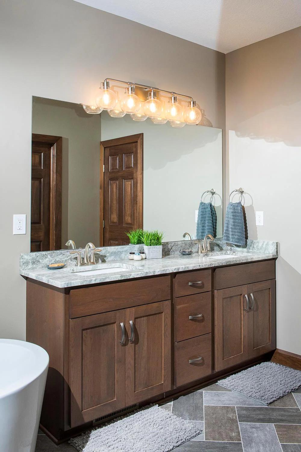 Beautifully balanced modern dark wood bathroom vanity design