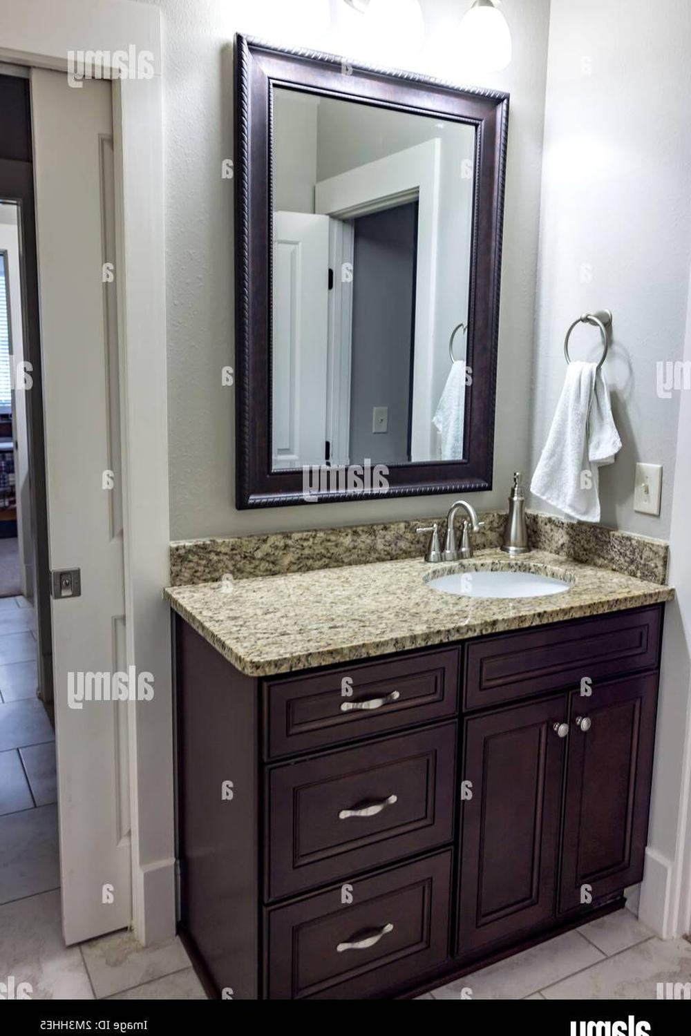 Graceful classic dark wood bathroom vanity with ornate details