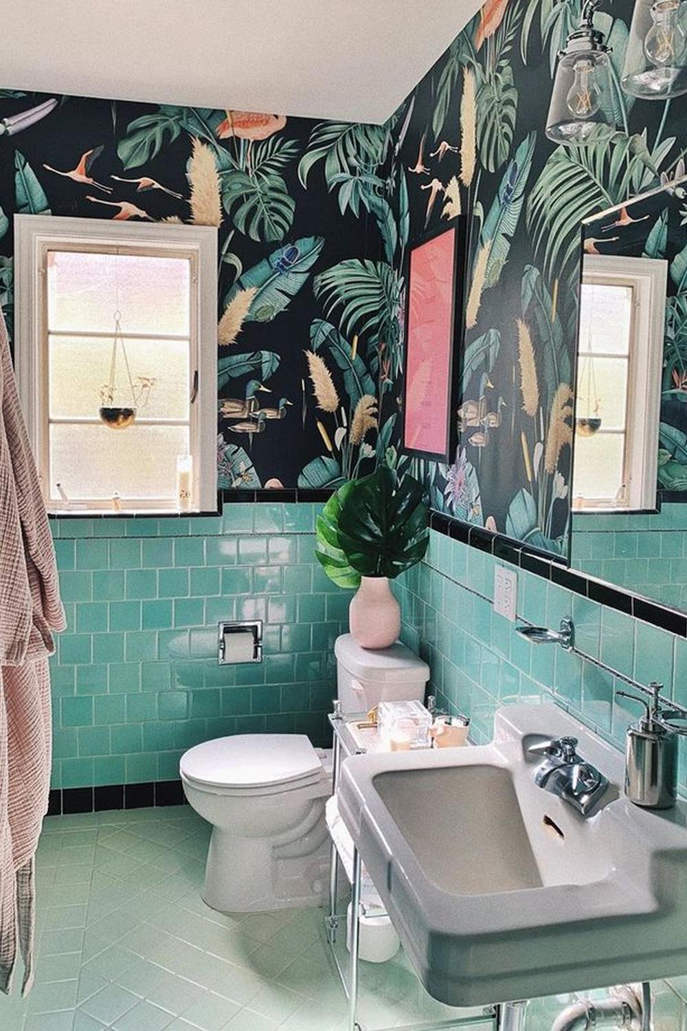 Tropical bathroom with deep teal aesthetics, featuring bold design elements.