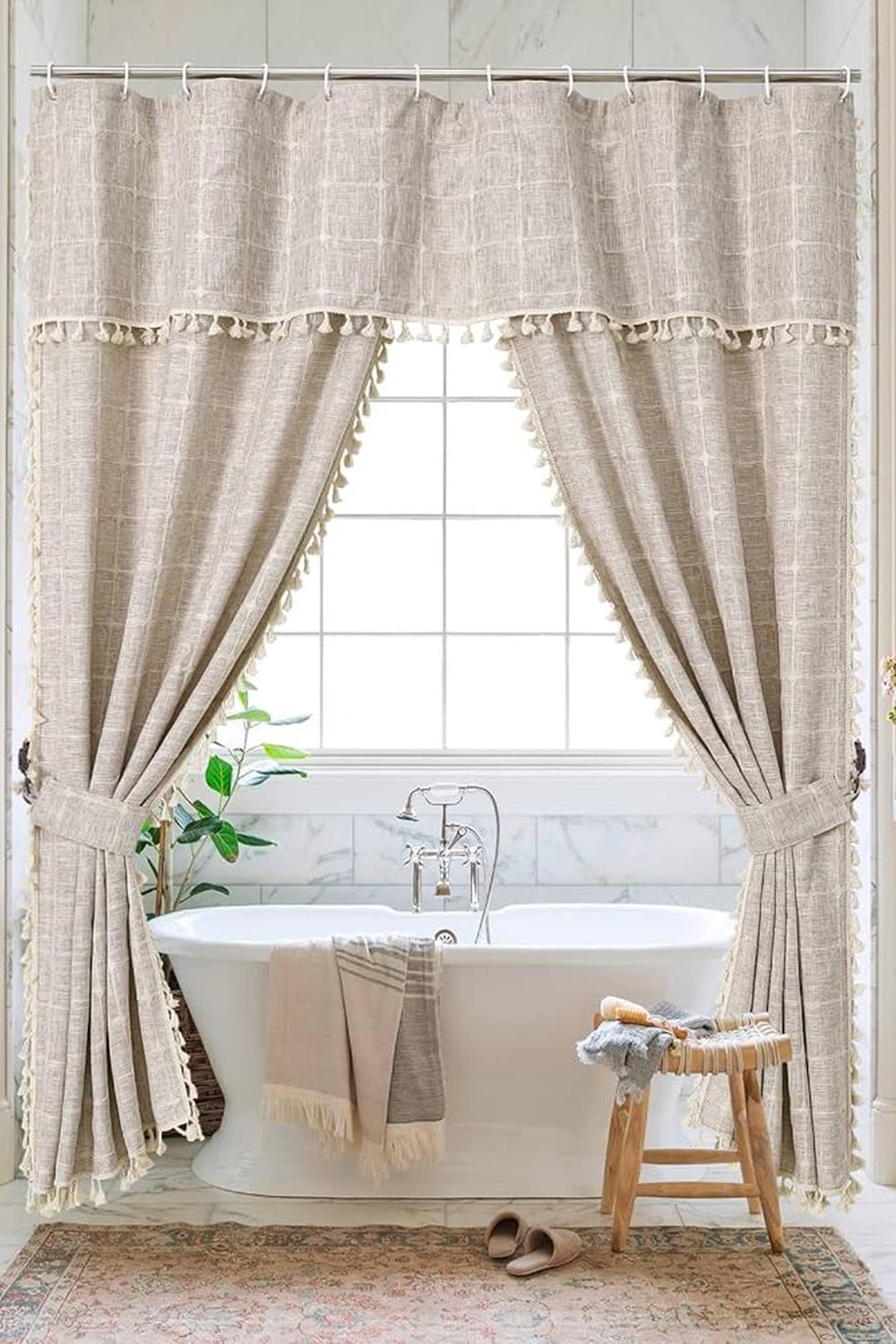 Timeless bathroom featuring beige double shower curtains with intricate detailing and elegant touches.