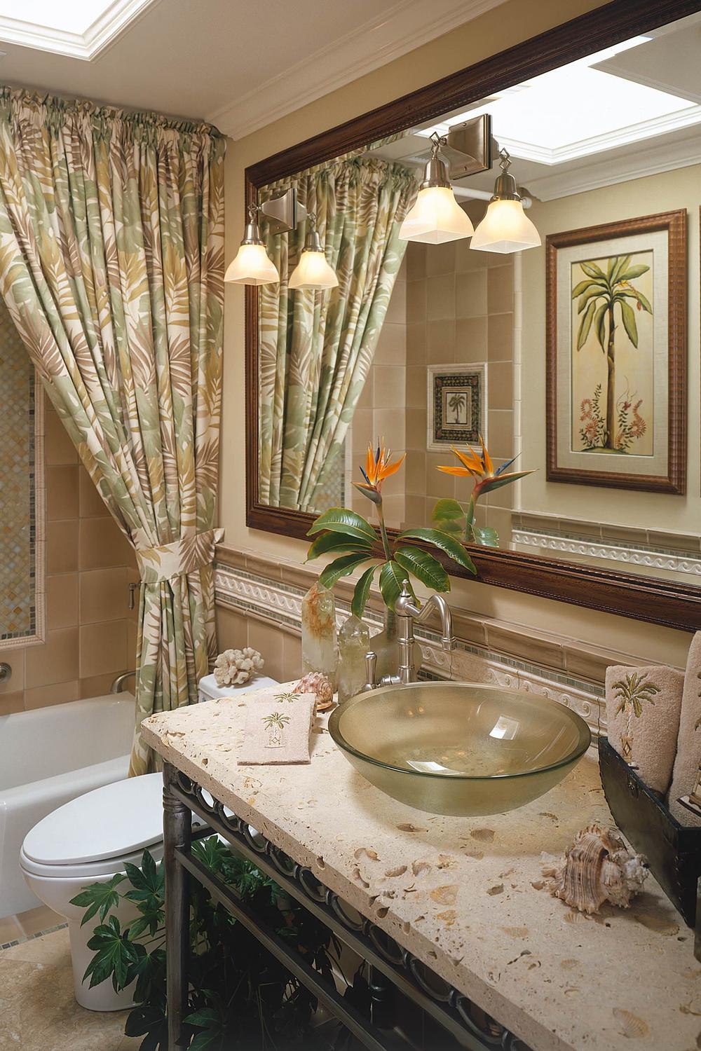 Tropical-themed bathroom with leafy double shower curtains creating a vibrant and inviting space.