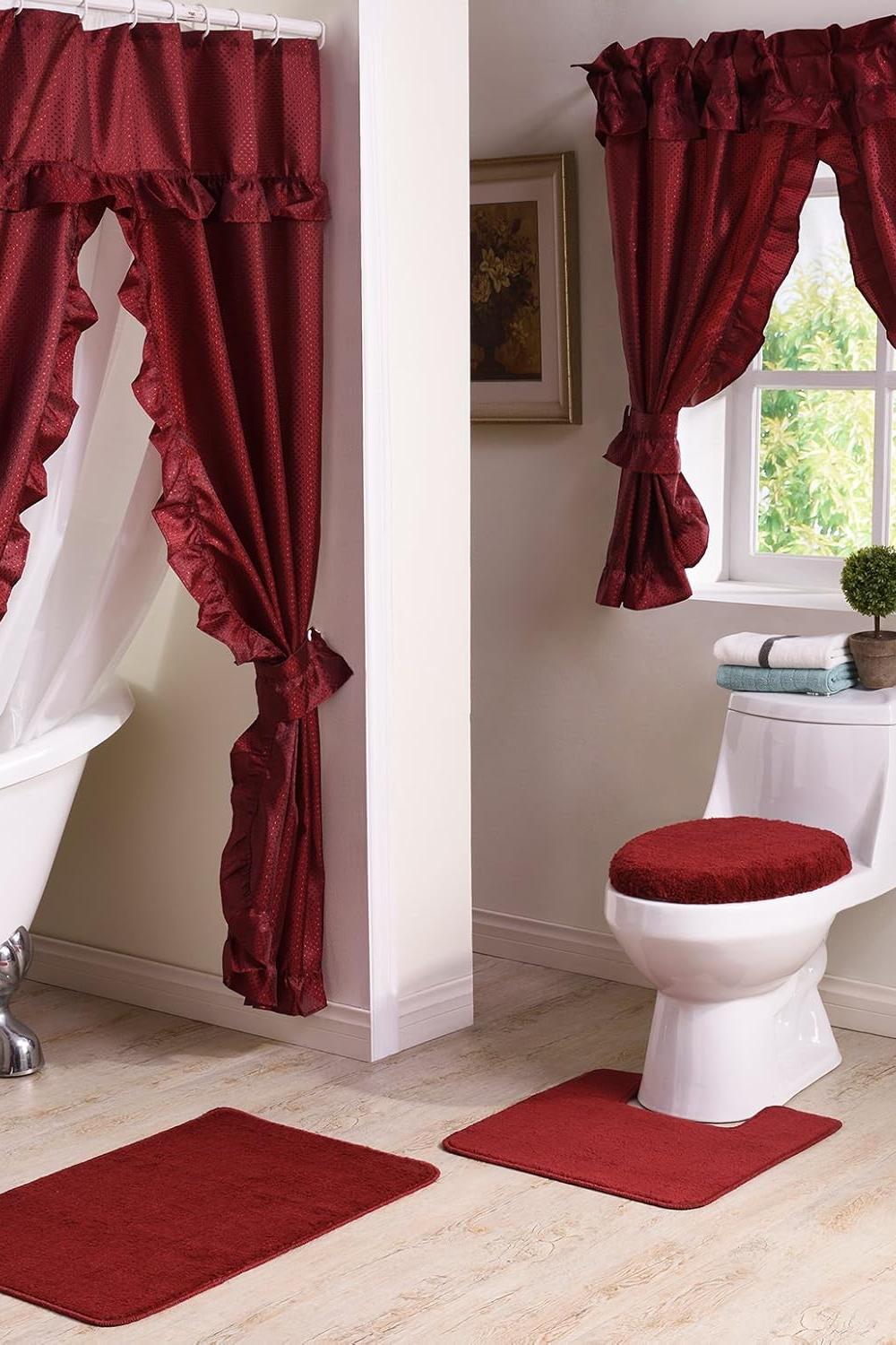 Richly designed bathroom with red curtains and floral decor creating a romantic ambiance.