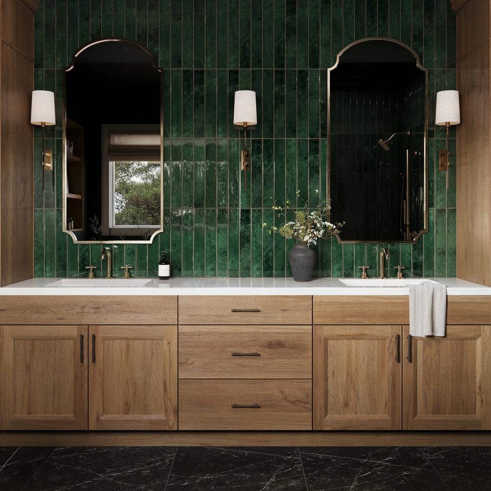 A modern bathroom with a vertical emerald tile wall enhancing visual height
