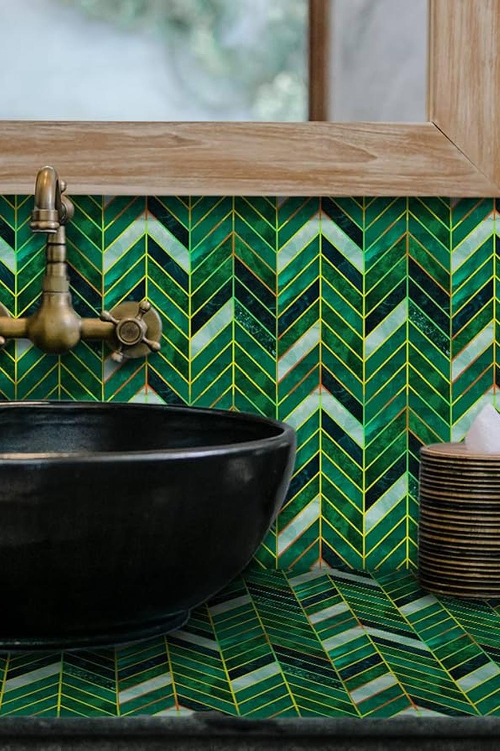 A luxurious bathroom featuring a herringbone pattern with emerald green accents