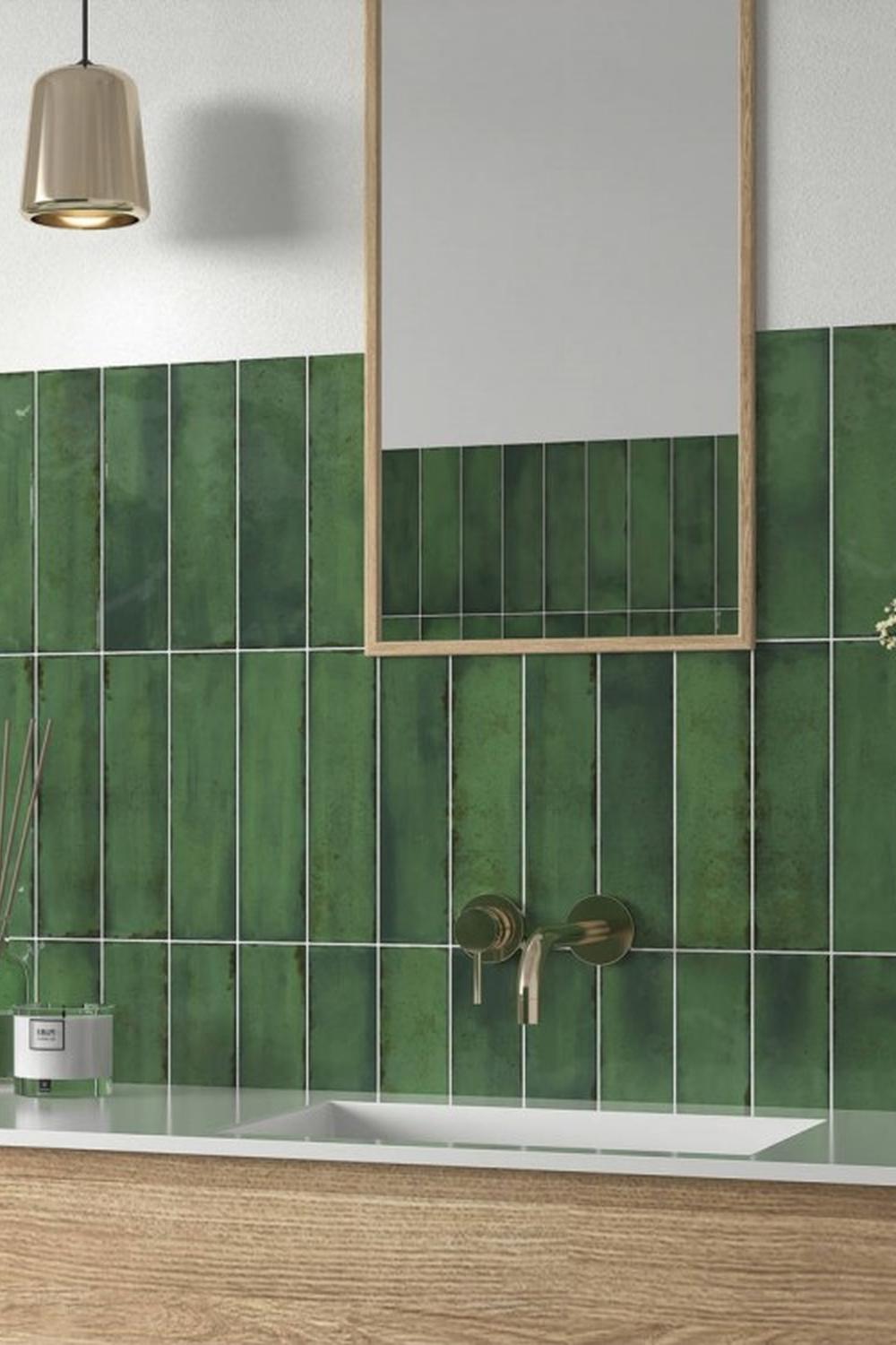 An elegant modern bathroom featuring emerald green tile