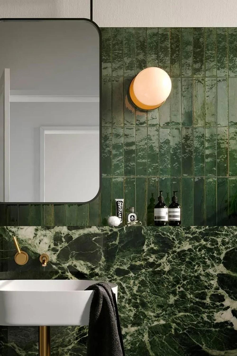 A contemporary bathroom featuring emerald green finishes and fixtures
