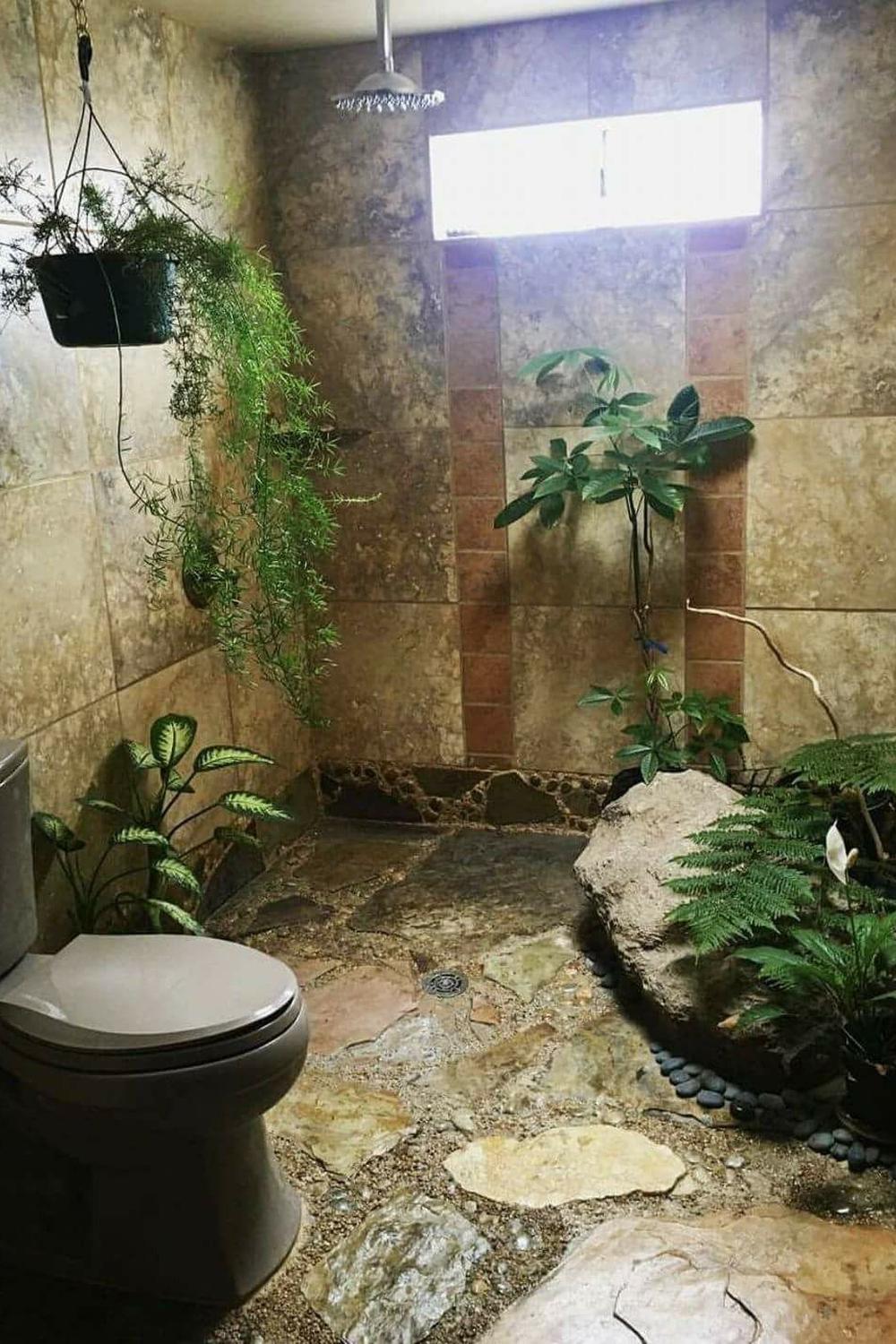 A bathroom featuring epoxy flooring with large stones embedded in resin, enhancing its natural and earthy aesthetic.