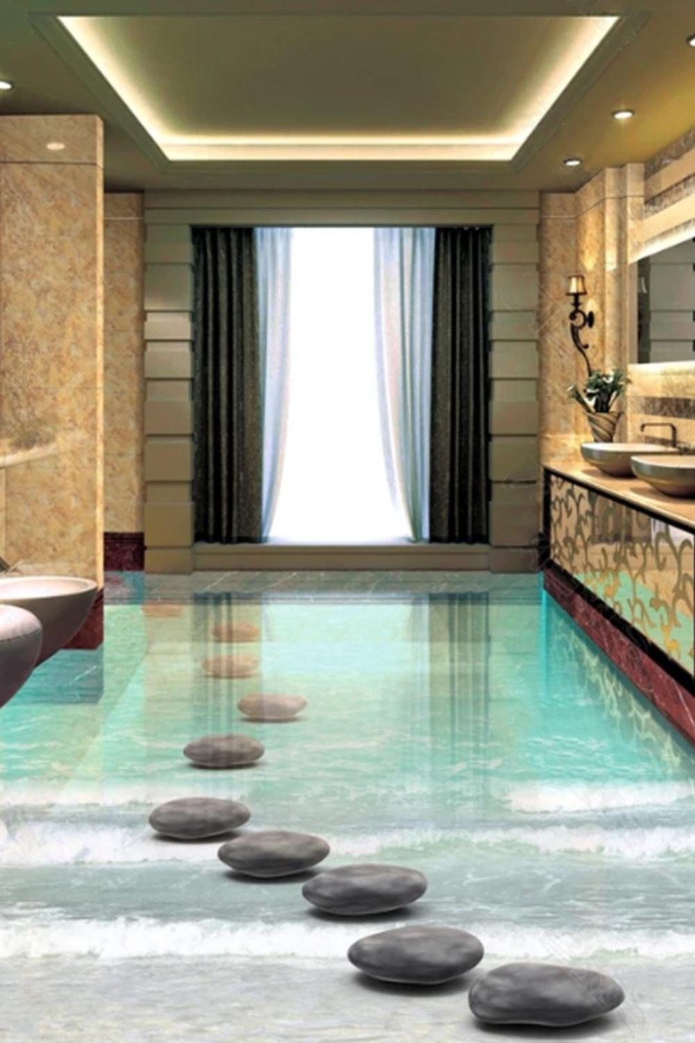 Bathroom design featuring an epoxy floor with a clear finish and dark stones creating a serene atmosphere.