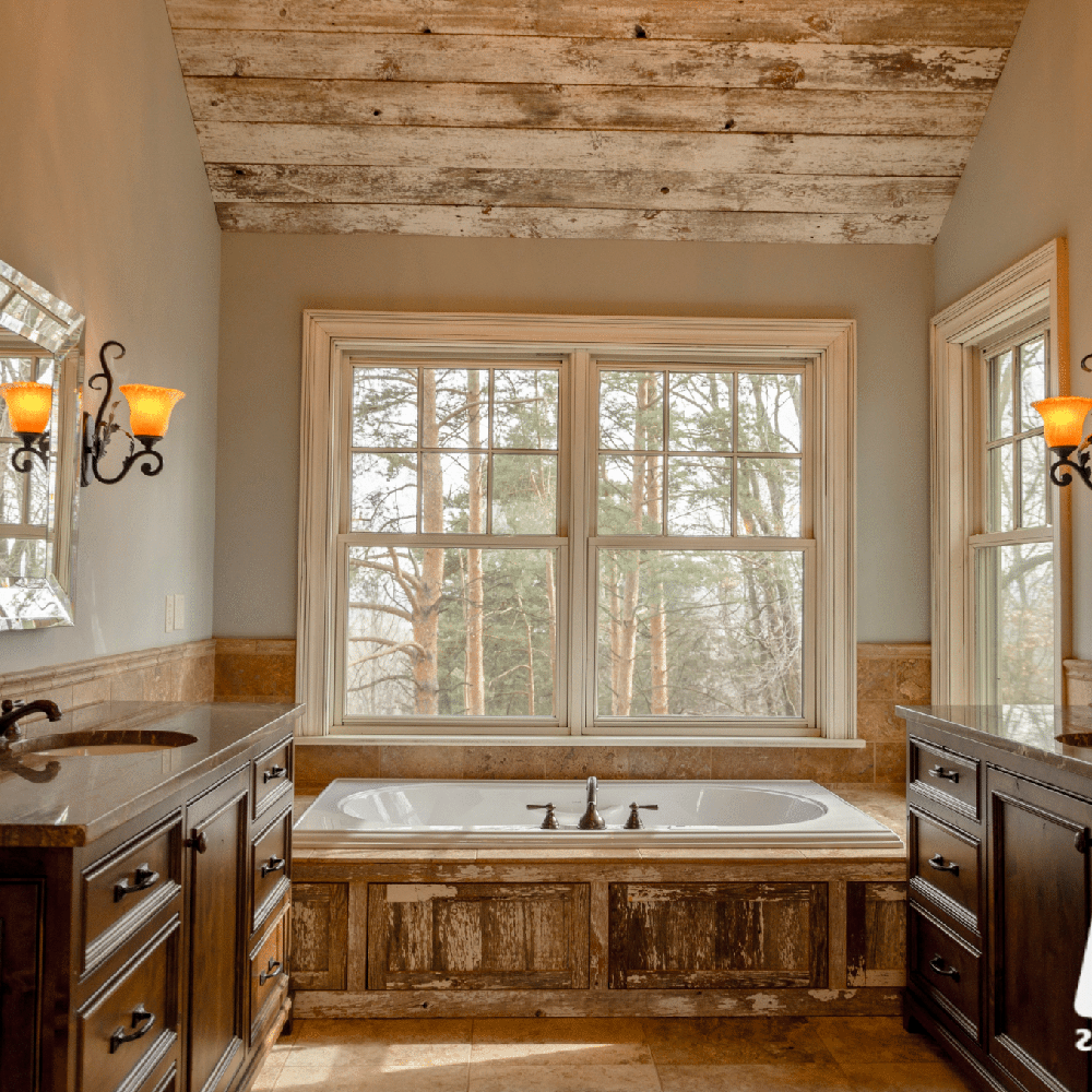Serene farmhouse bathroom featuring wooden beams and natural materials.