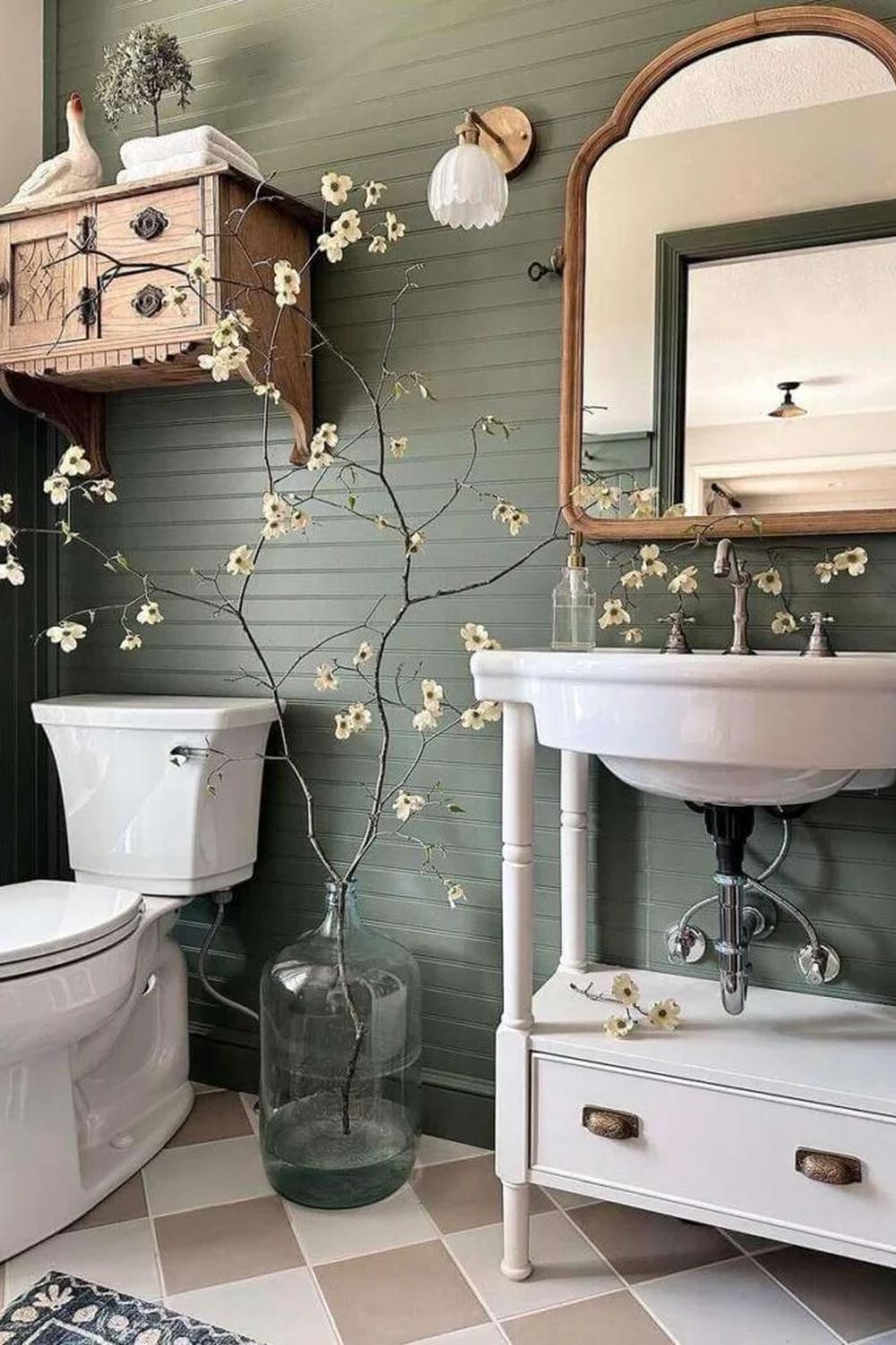 Beautiful farmhouse bathroom featuring an olive green color scheme and vintage accents.