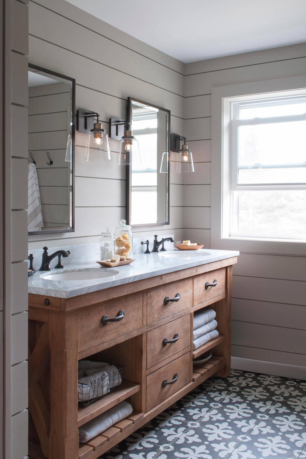 Farmhouse bathroom with modern features and classic country charm.