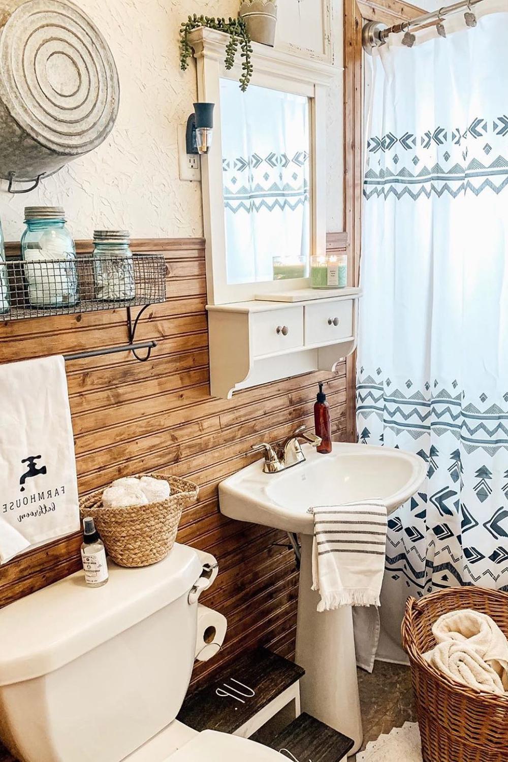 Cozy farmhouse bathroom showcasing rustic decor and minimalistic design.
