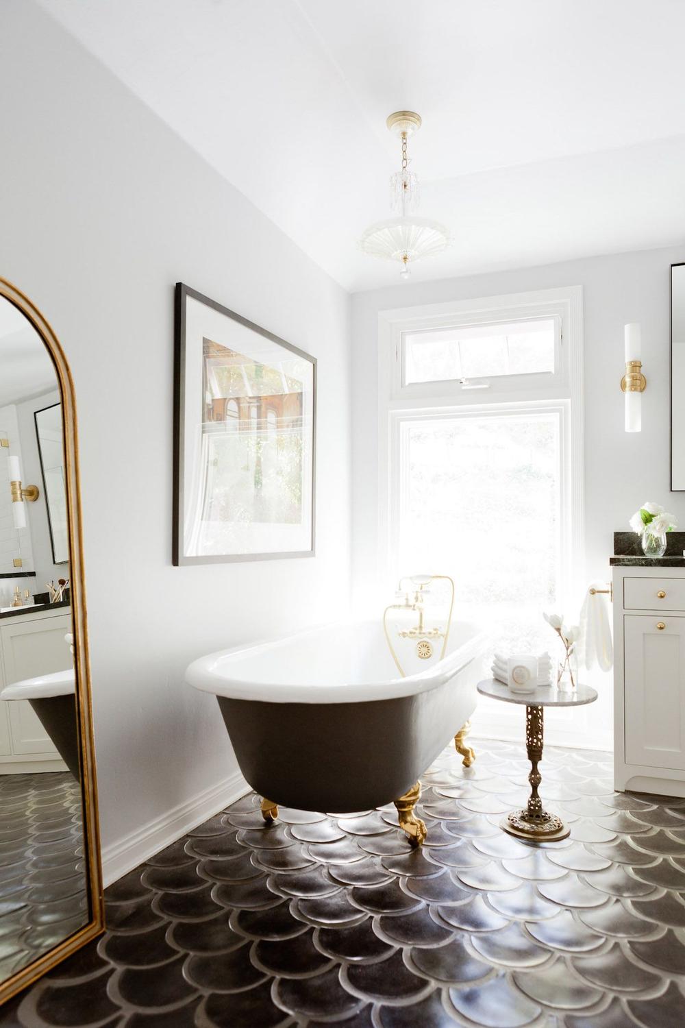 Bathroom featuring black and gray fish scale tile flooring