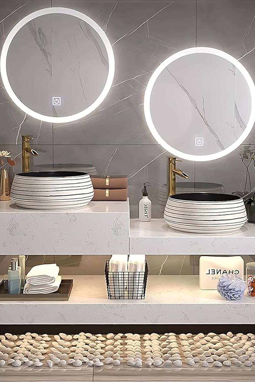 Floating marble vanity designed with distinct striped sinks and golden faucets giving a harmonious feel.