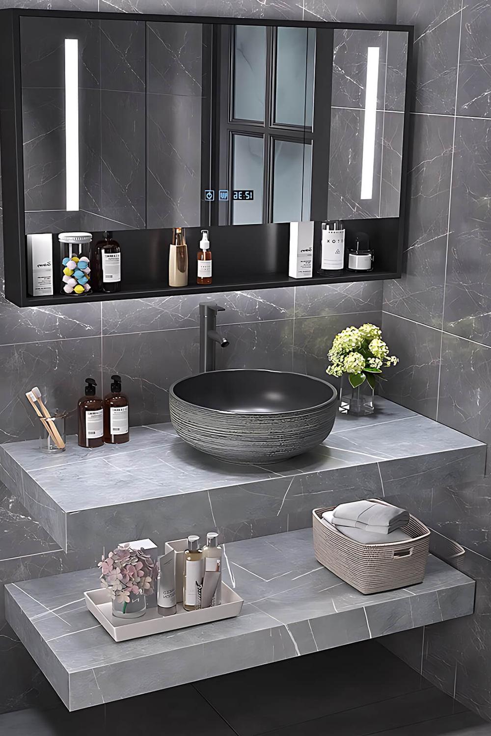 A textured floating marble vanity exhibiting a modern aesthetic combined with dark stone elements.