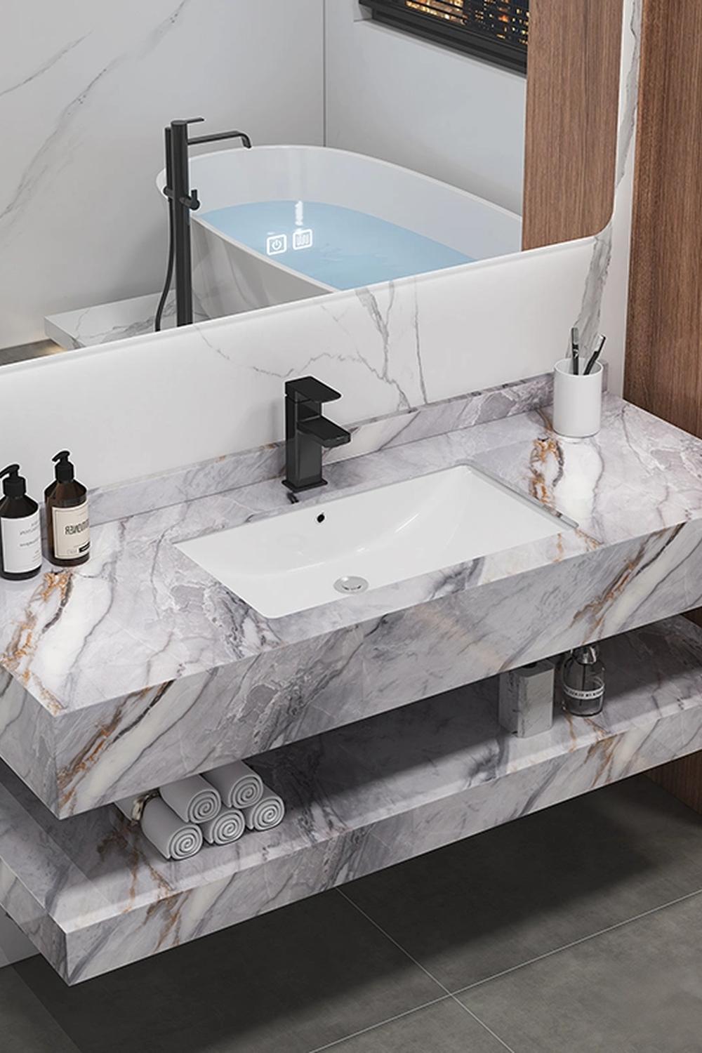 Modern floating marble vanity featuring open marble shelves and sleek mirrored accents.