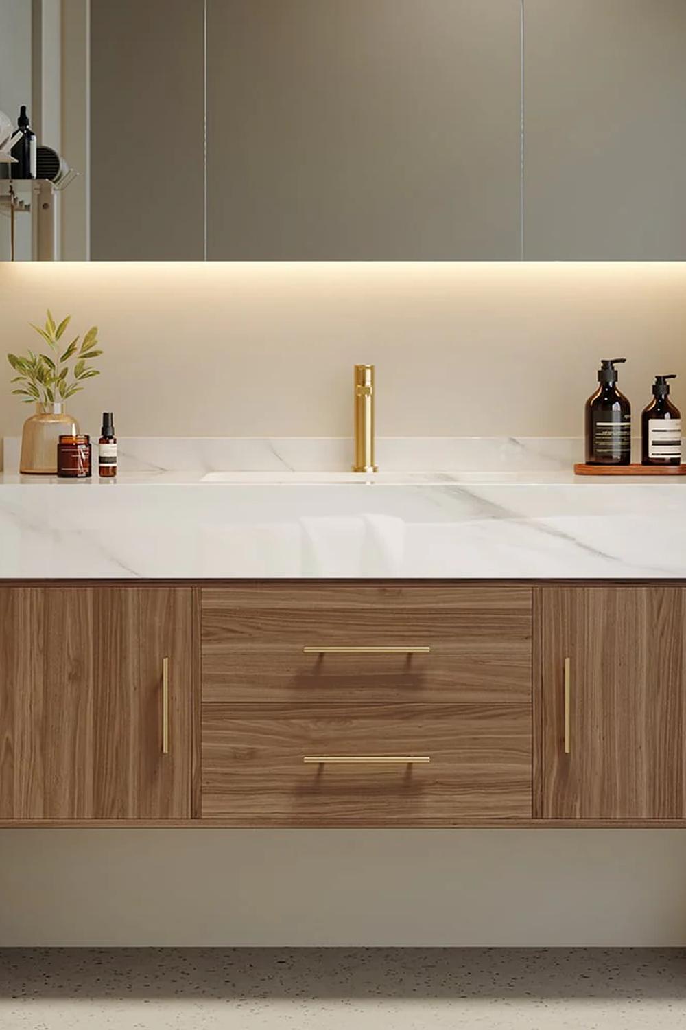 A chic floating marble vanity with a circular mirror and warm lighting accents.