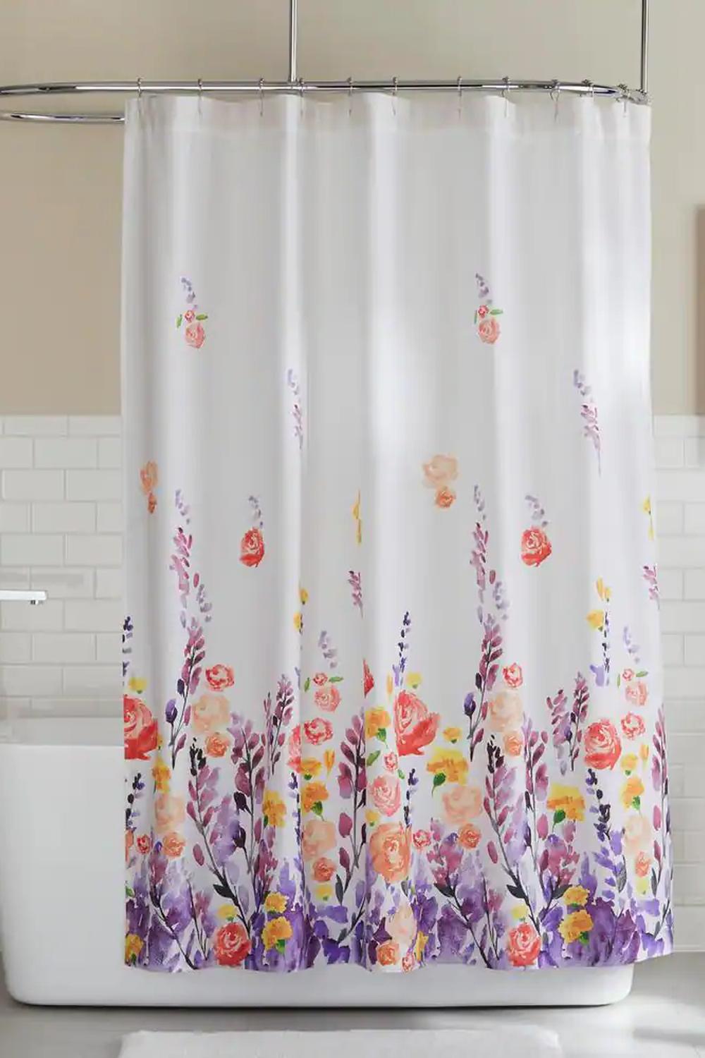 Bold floral shower curtain featuring vibrant red flowers creating a striking focal point in a modern bathroom.