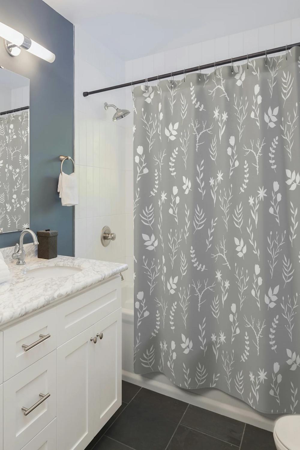 Modern elegant floral shower curtain with gray and white designs adding sophistication to bathroom decor.
