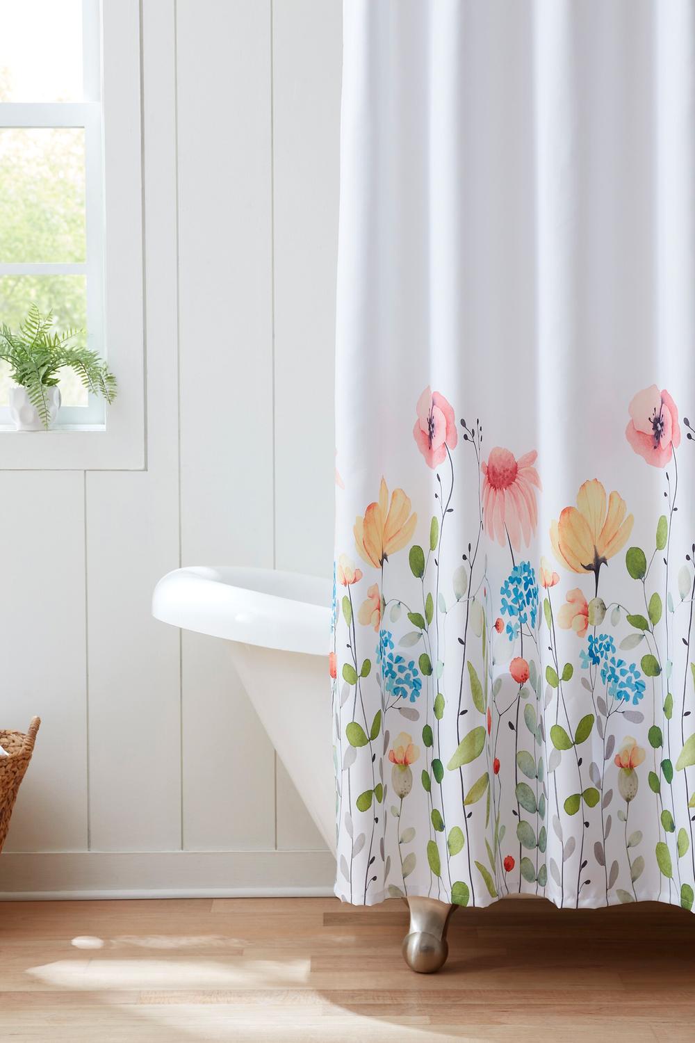 A flurry of watercolor blooms shower curtain adding a vibrant touch to the bathroom.