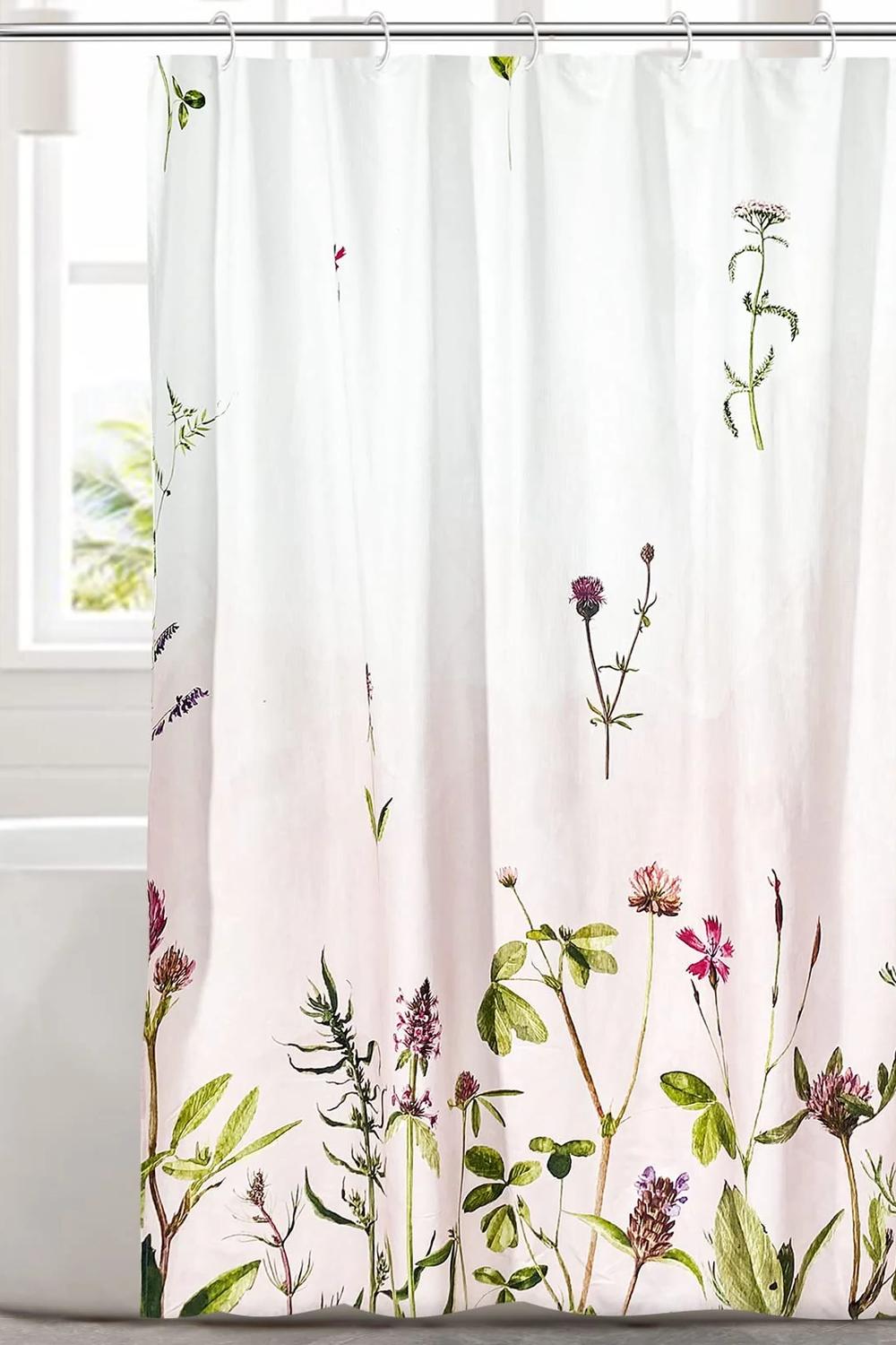 Sweetly floral shower curtain brightening up a calming bathroom environment.