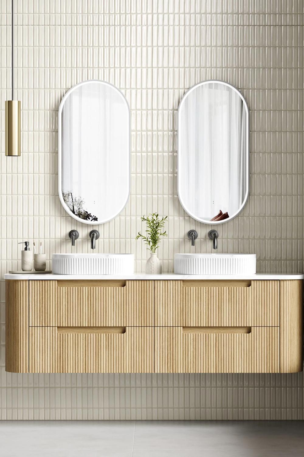 Modern fluted bathroom vanity with light wood and white countertop