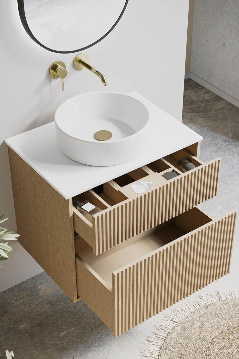 Minimalist fluted bathroom vanity with white vessel sink and gold accents