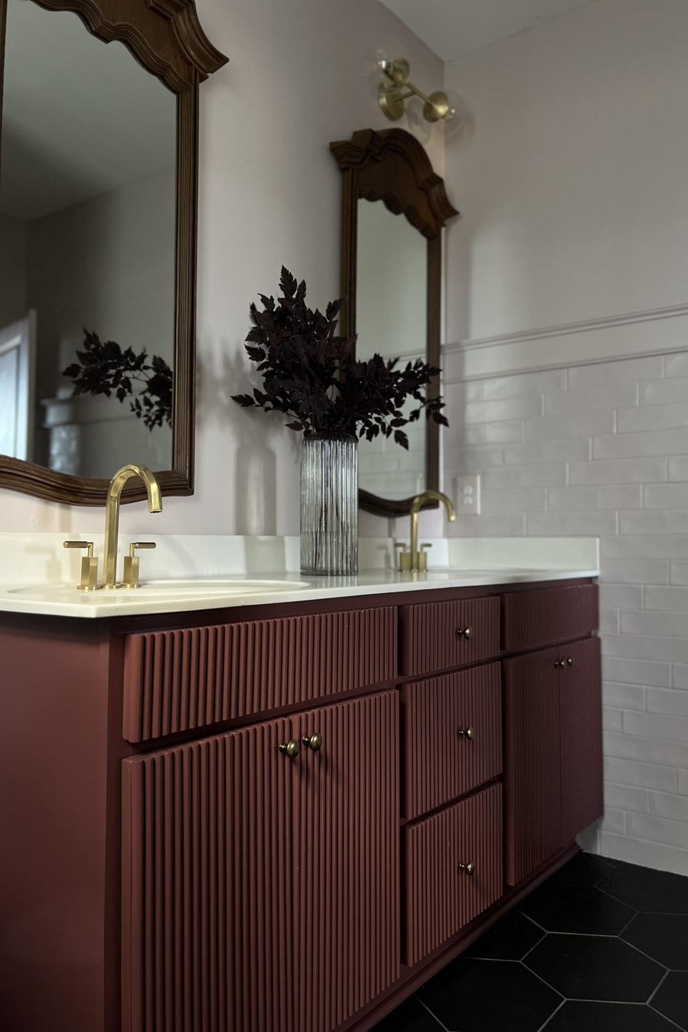 Rich burgundy fluted bathroom vanity with white countertop