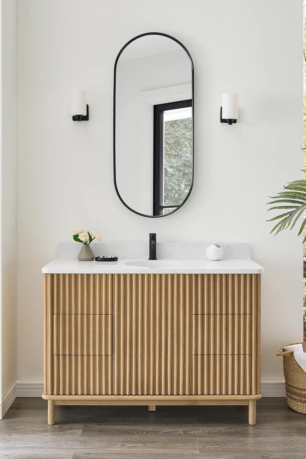 Stylish fluted bathroom vanity with light wood and minimalistic touch
