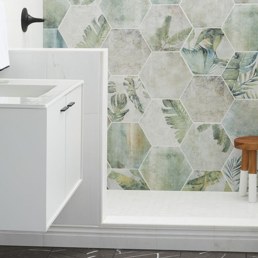 Tropical-themed bathroom featuring hexagonal green tiles and natural elements