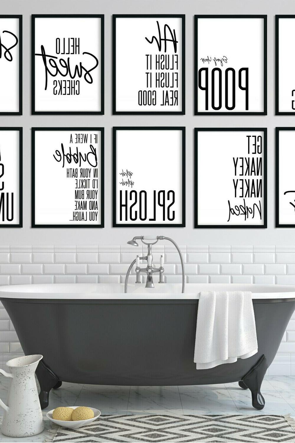 A framed artwork in a bathroom depicting the phrase 'Hello Sweet Cheeks' in playful fonts.