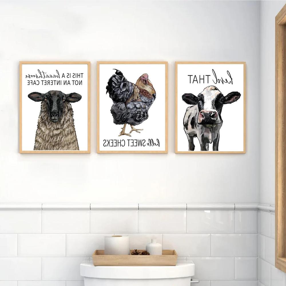 Framed illustrations of farm animals with funny phrases.