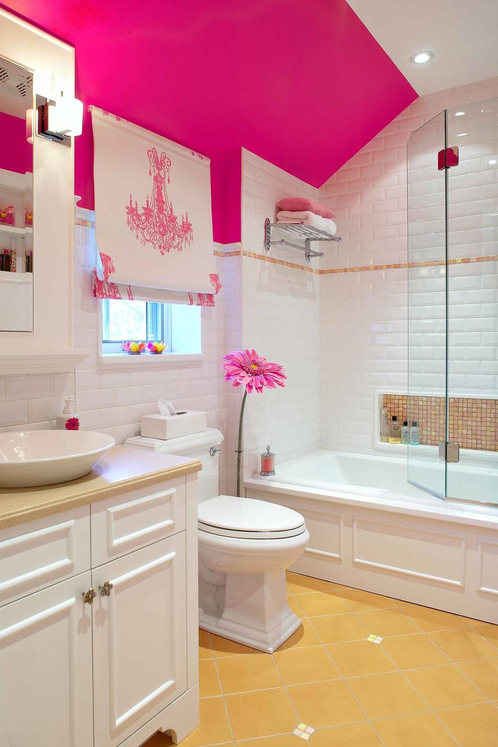 Chic bathroom with hot pink ceiling and natural wood accents