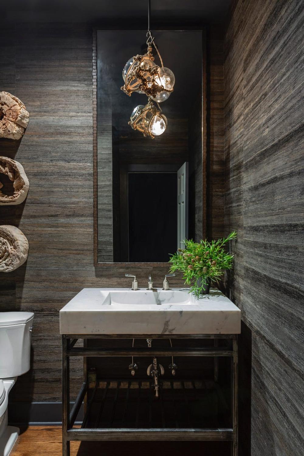 Refreshing shades of gray in a bathroom adorned with elegant grasscloth wallpaper.