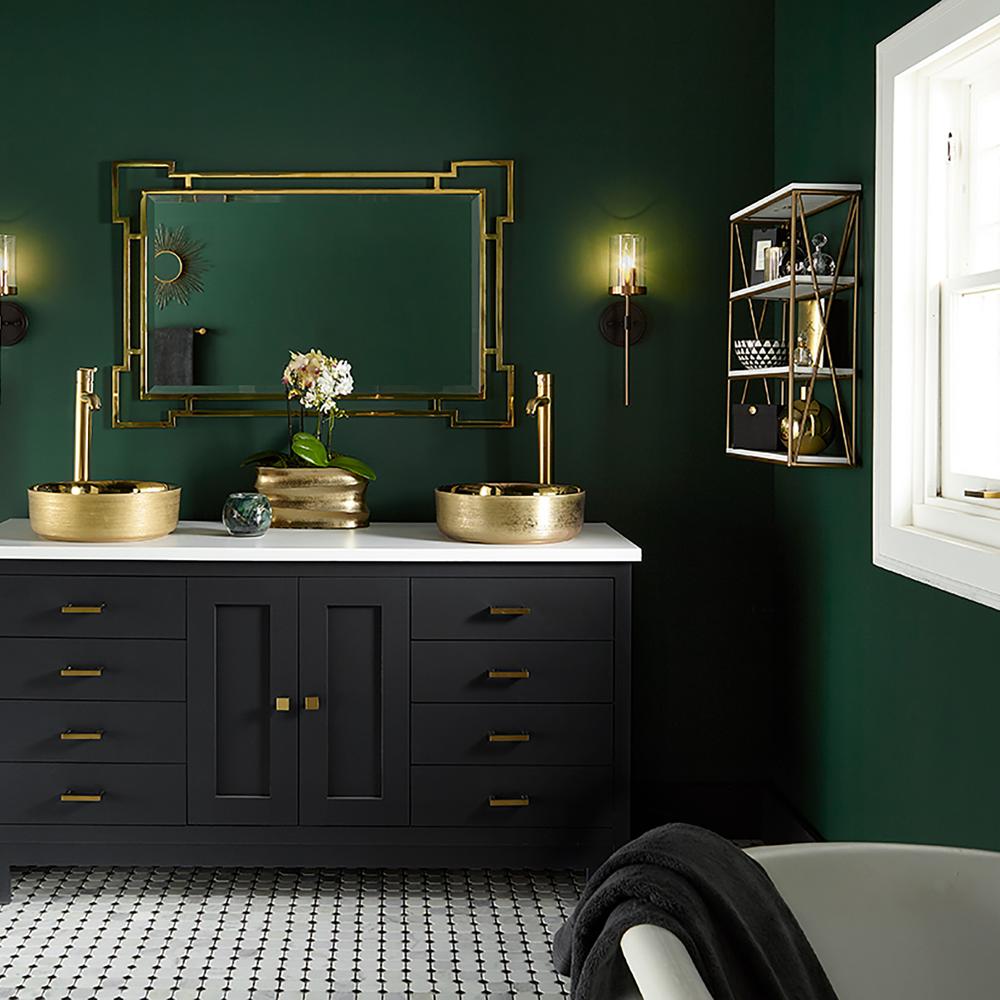 Sophisticated bathroom design with deep green walls and gold accents.