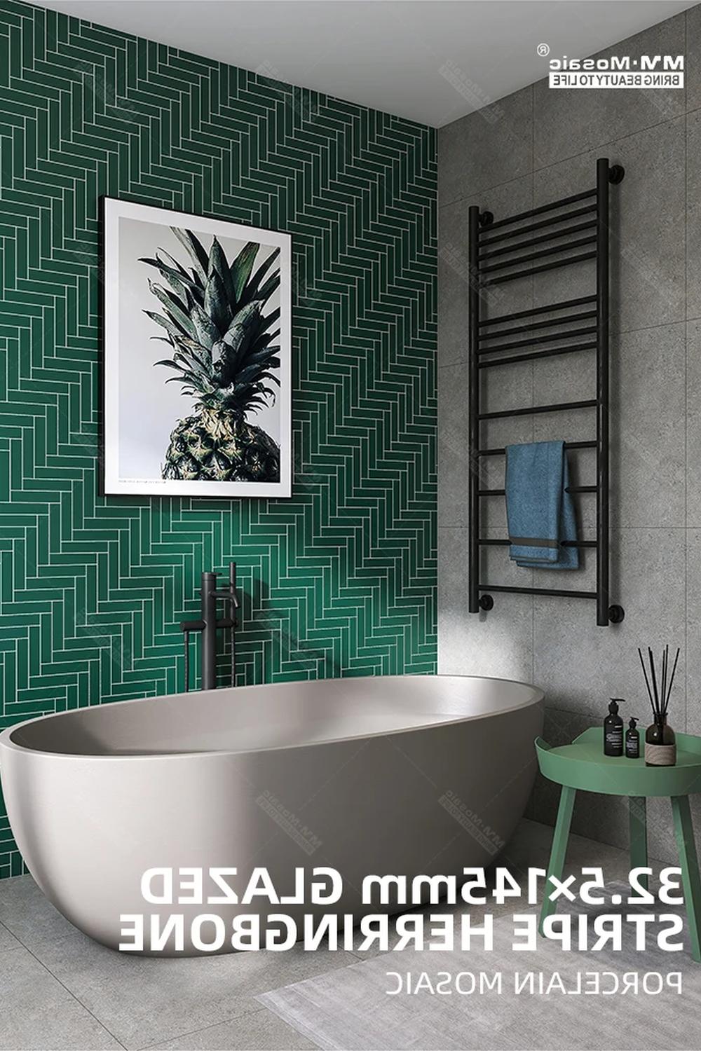 Baño moderno con azulejos verde en sarga y bañera ovalada.