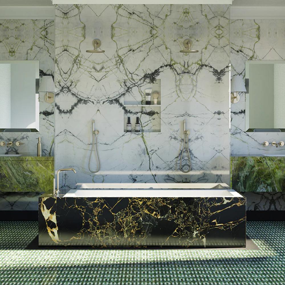 An elegant bathroom featuring a combination of green and black marble elements.