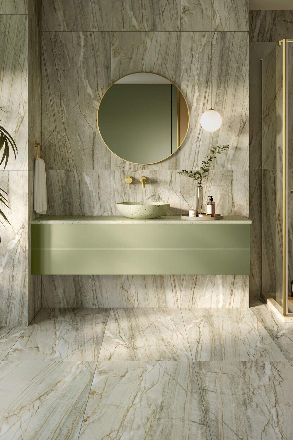 A modern bathroom design featuring a floating vanity and green marble tiles.