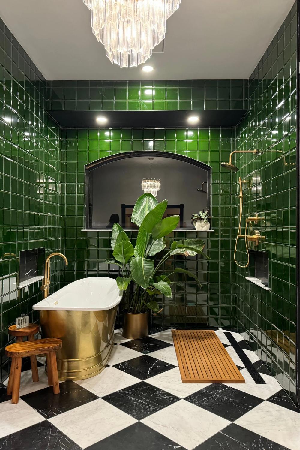 Luxurious bathroom featuring glossy emerald green tiles and a freestanding bathtub.