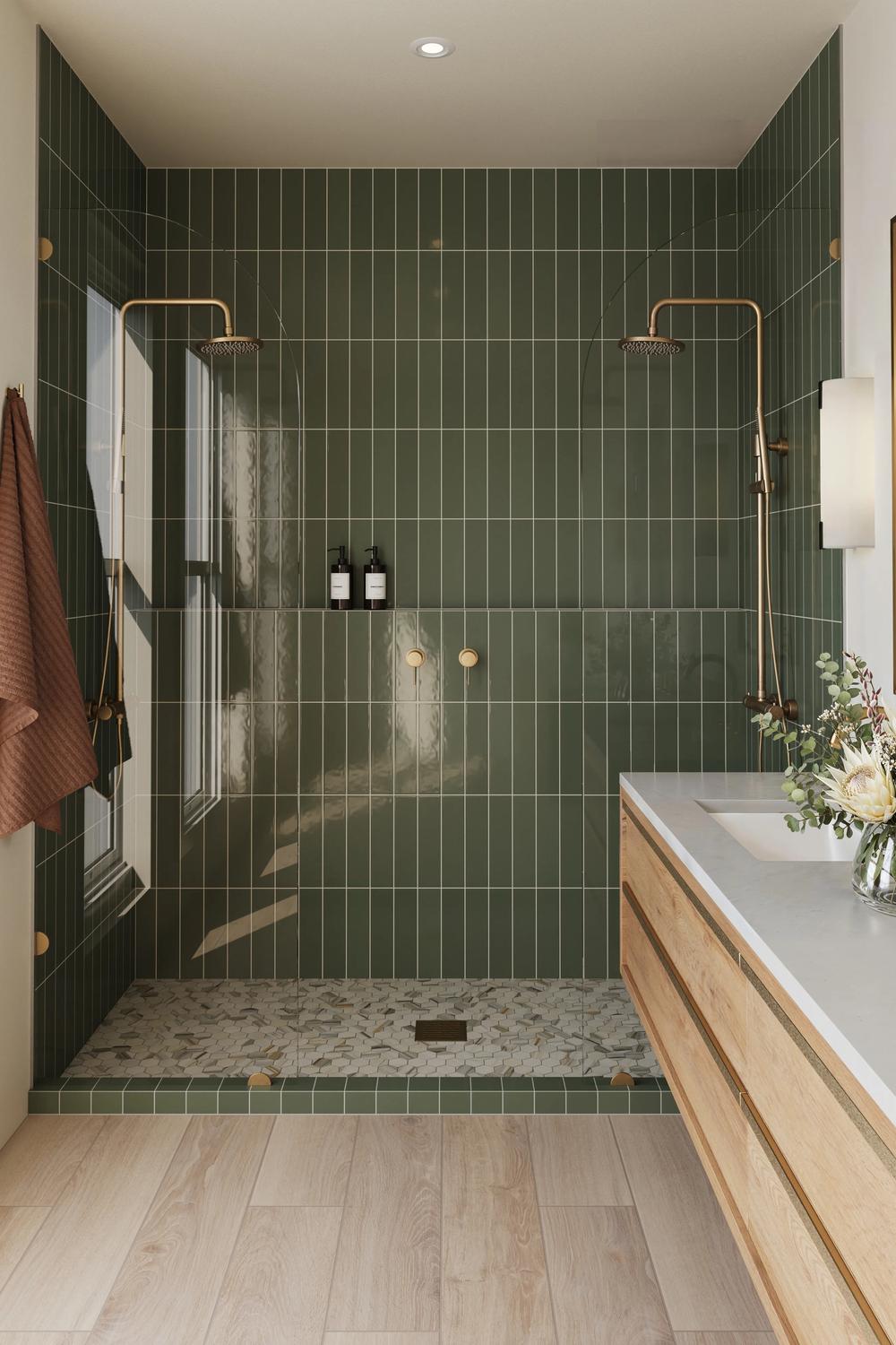 Stylish bathroom with unique gold accents set against vibrant green tiles.