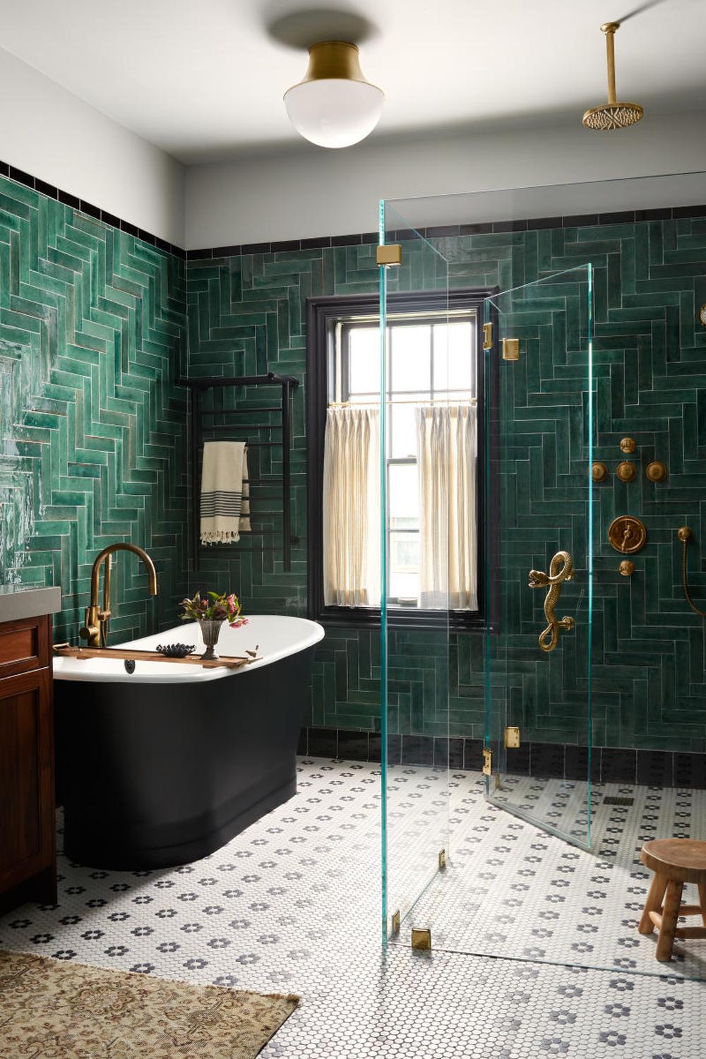 Stylish modern bathroom featuring eco-friendly design with green tiles.