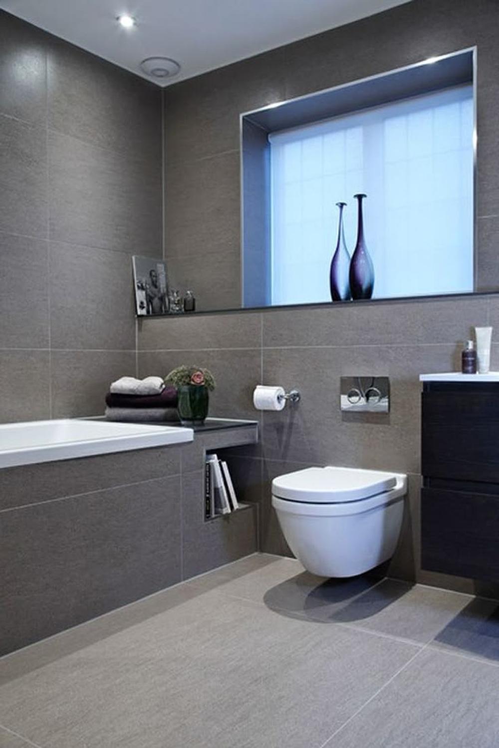 Baño gris diseñado con una estética minimalista